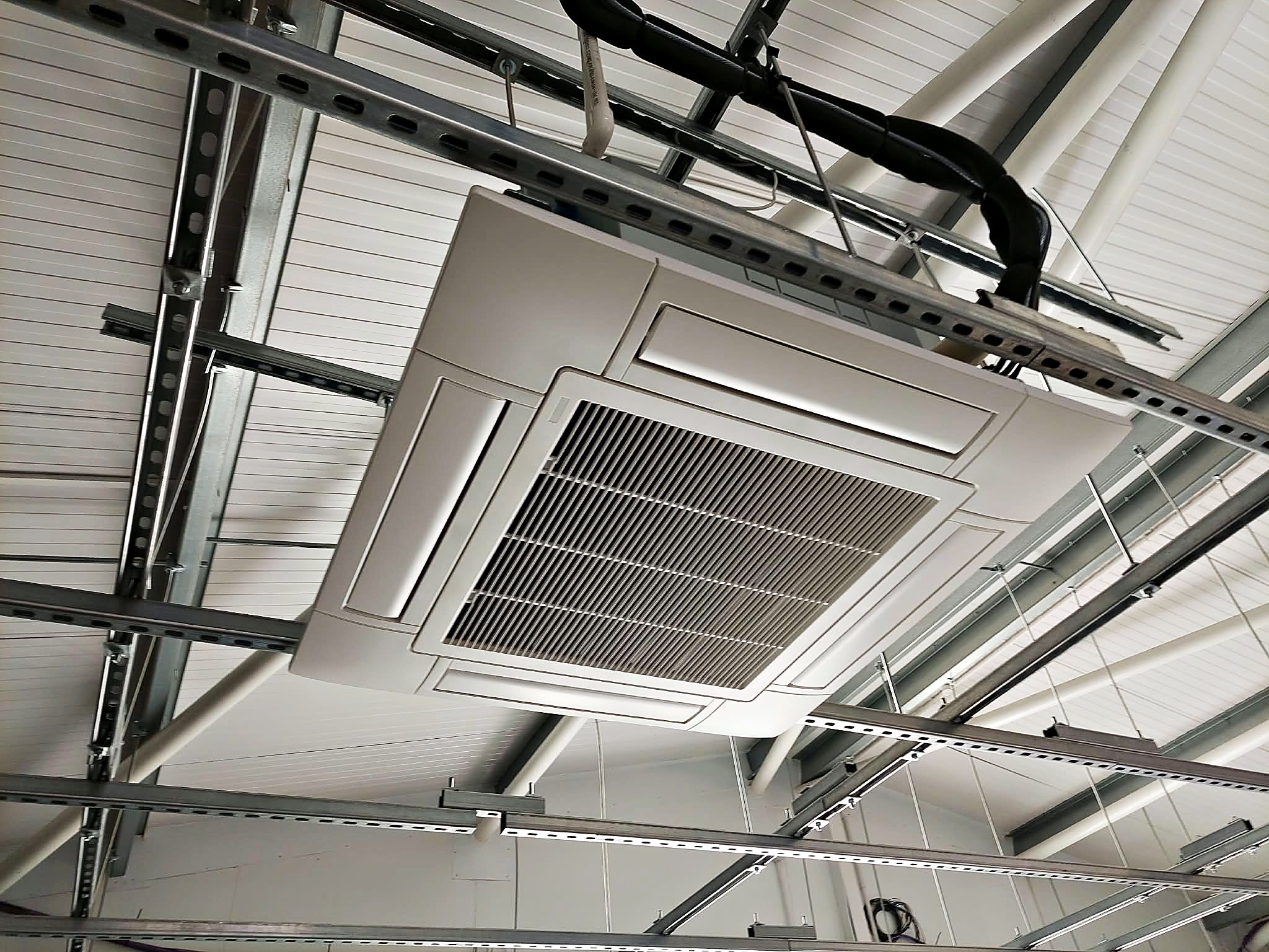 Ceiling cassette unit fitted into the roof of a commercial unit