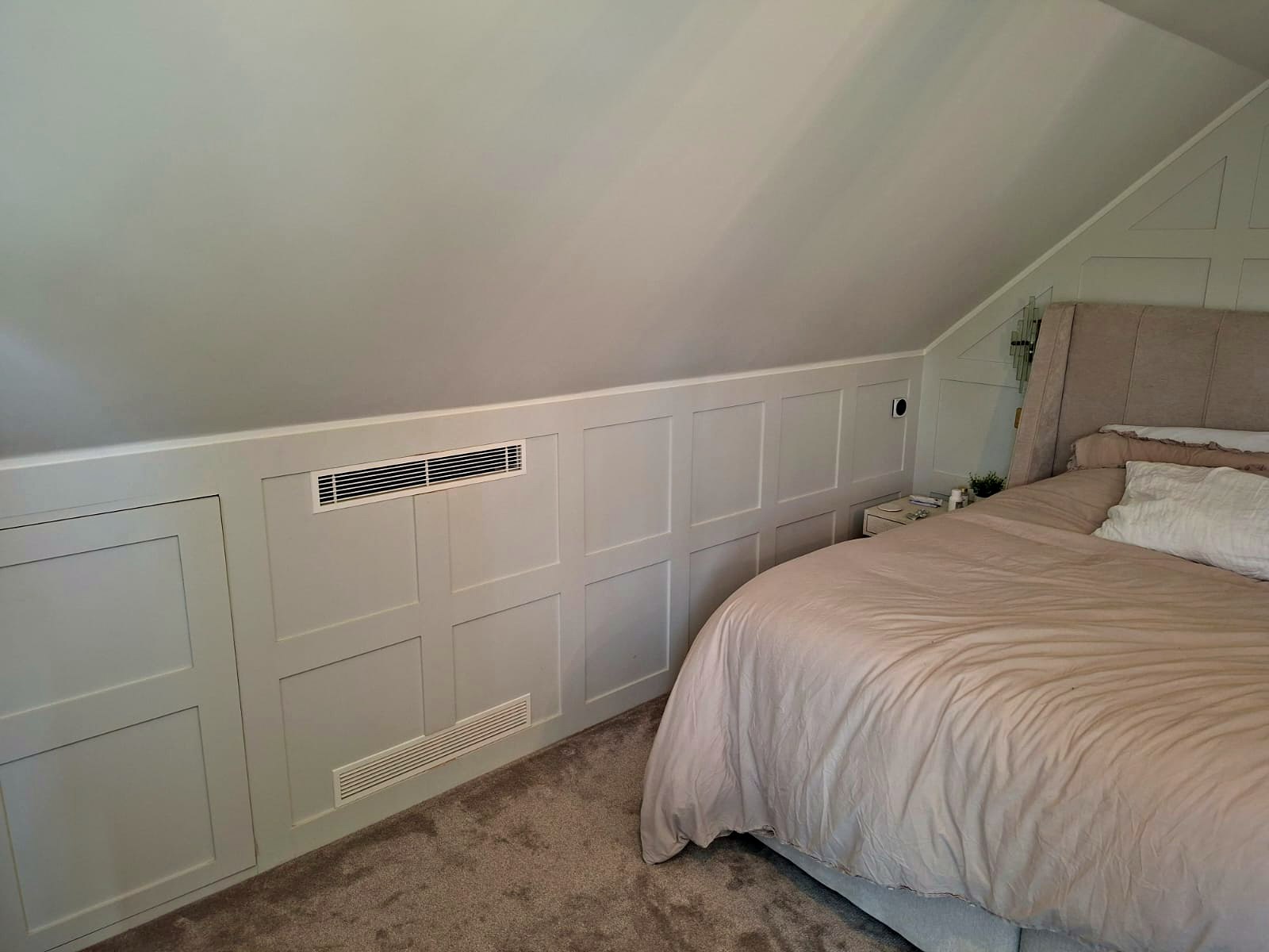 Slimline ducted grille set into the ceiling of a finished room