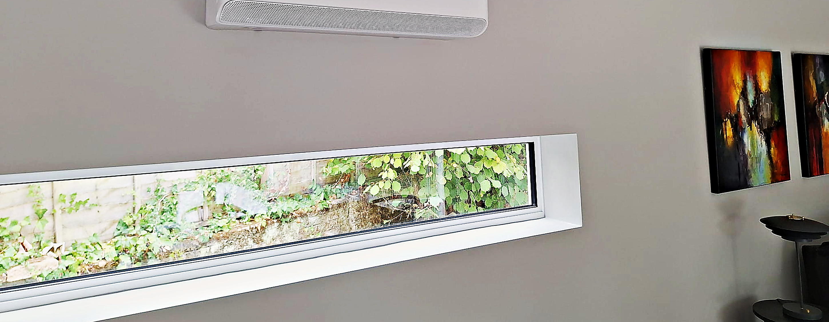 Wall mounted unit fitted high on a living room wall