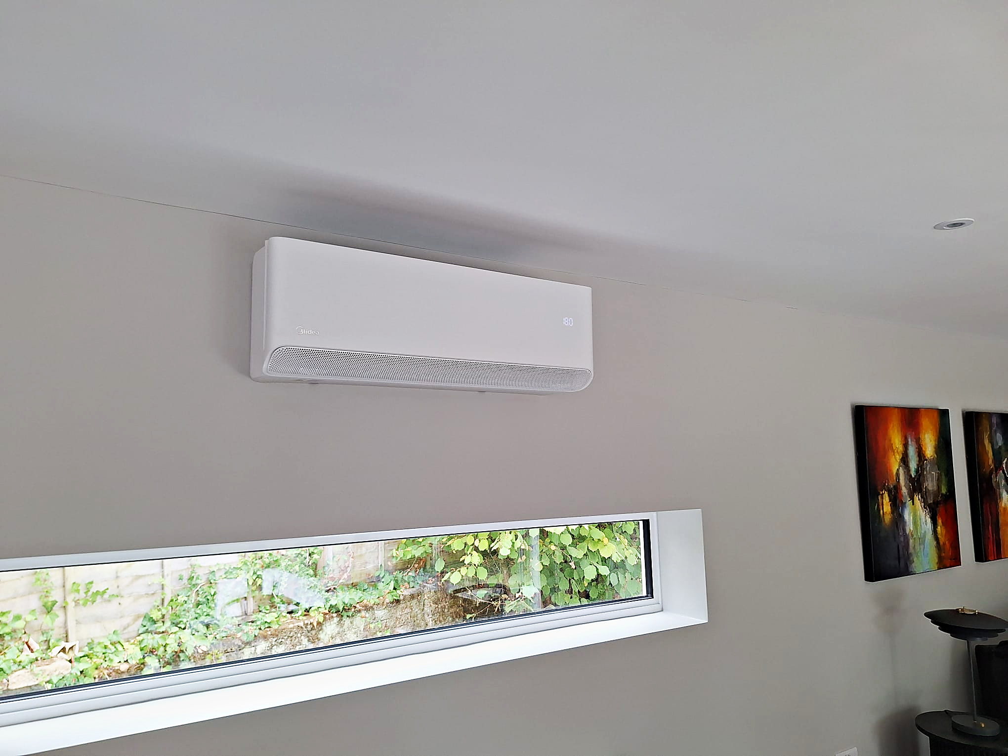 Wall mounted unit fitted high on a living room wall