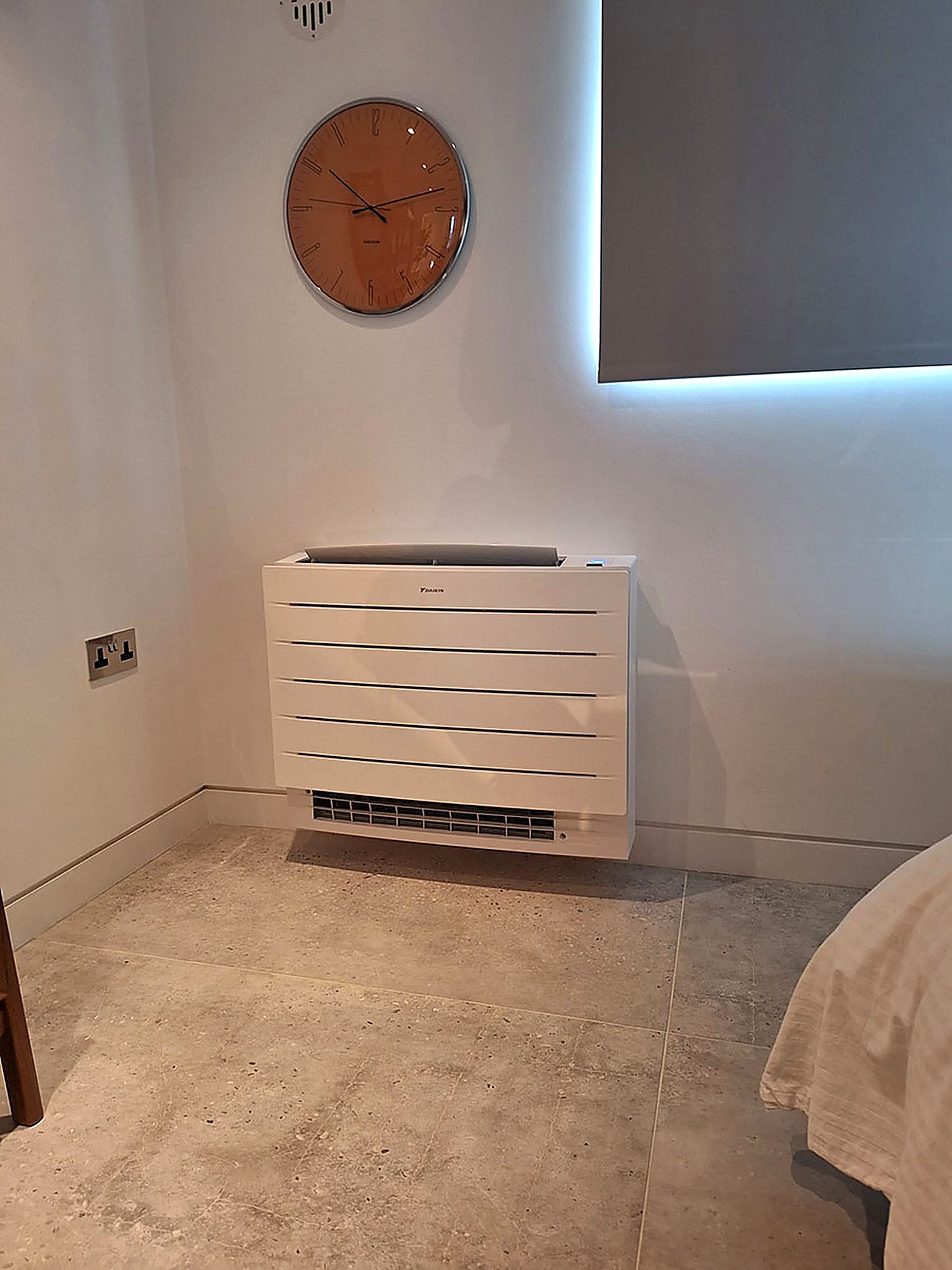 White floor standing console in a bedroom