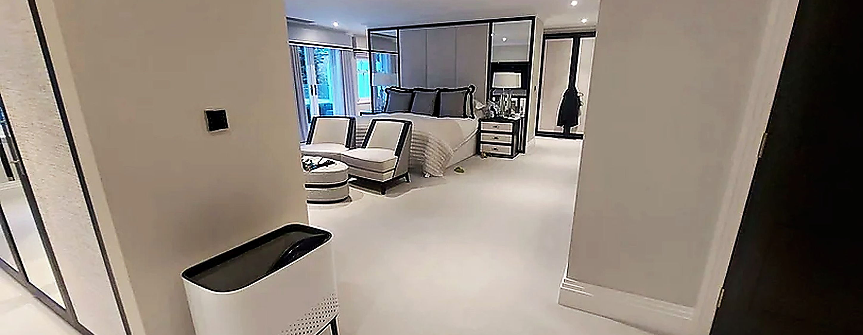 Bedroom suite with a discreet unit fitted above the doorway