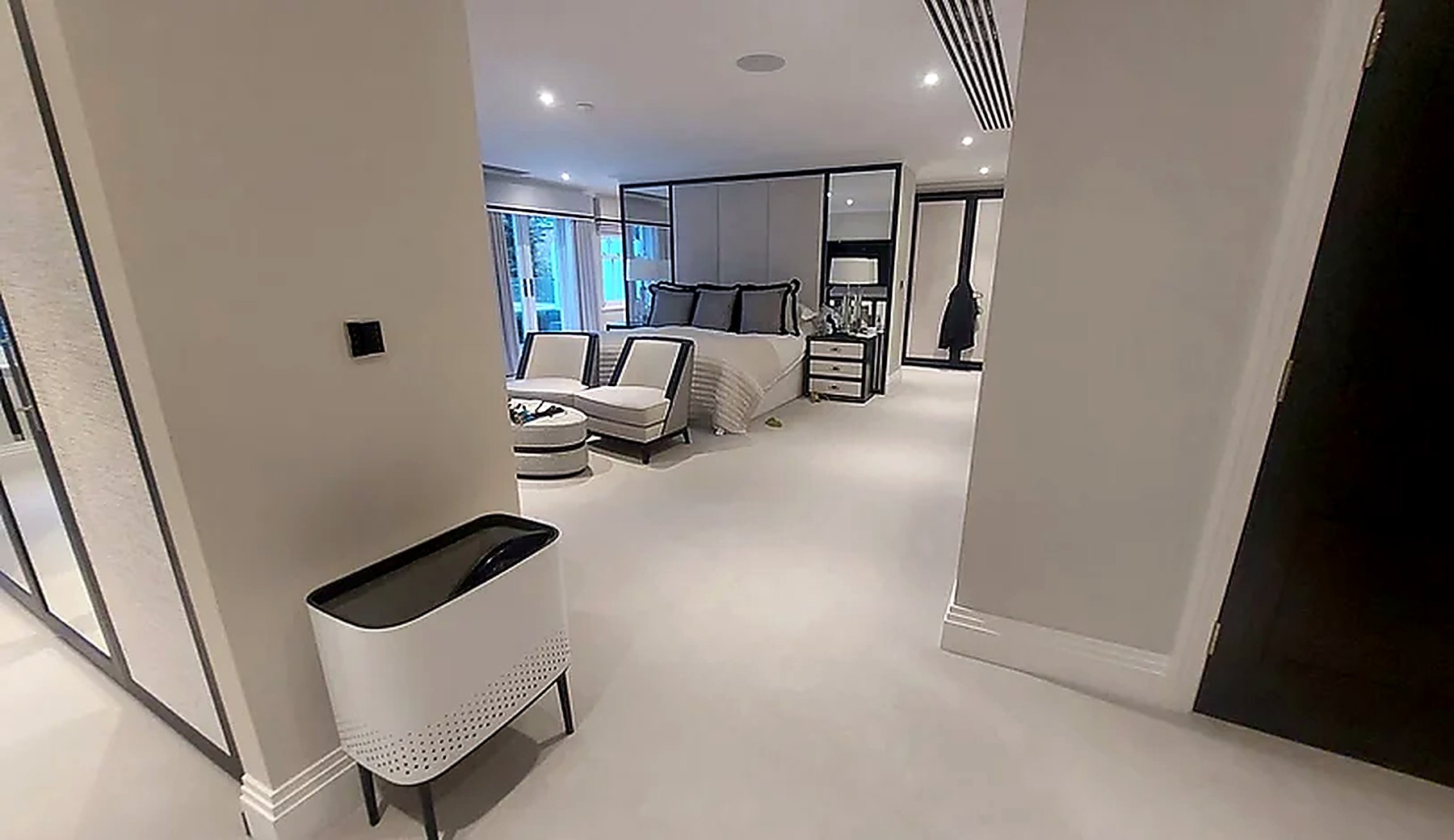 Bedroom suite with a discreet unit fitted above the doorway