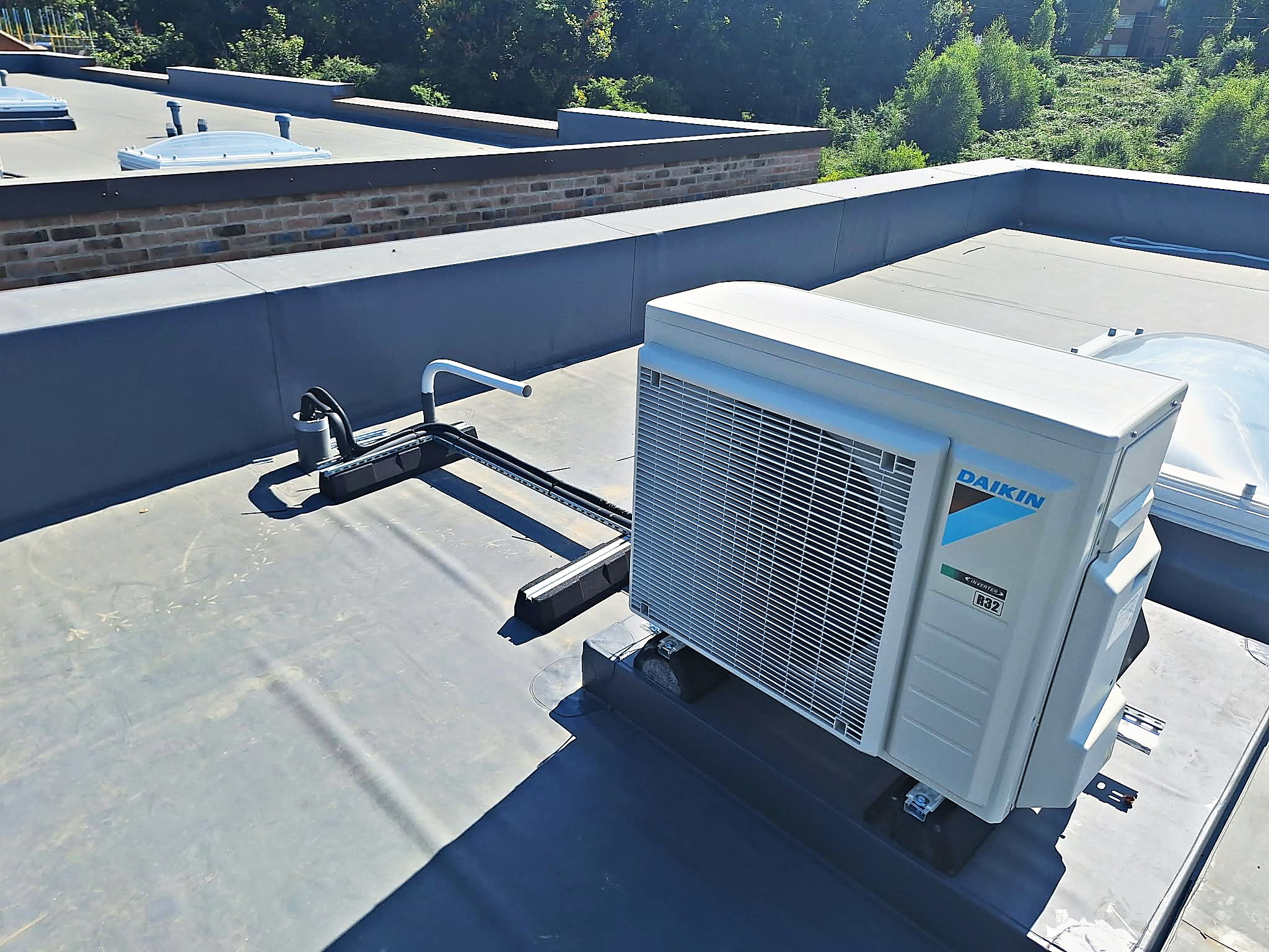 Daikin condenser unit installed on a flat roof